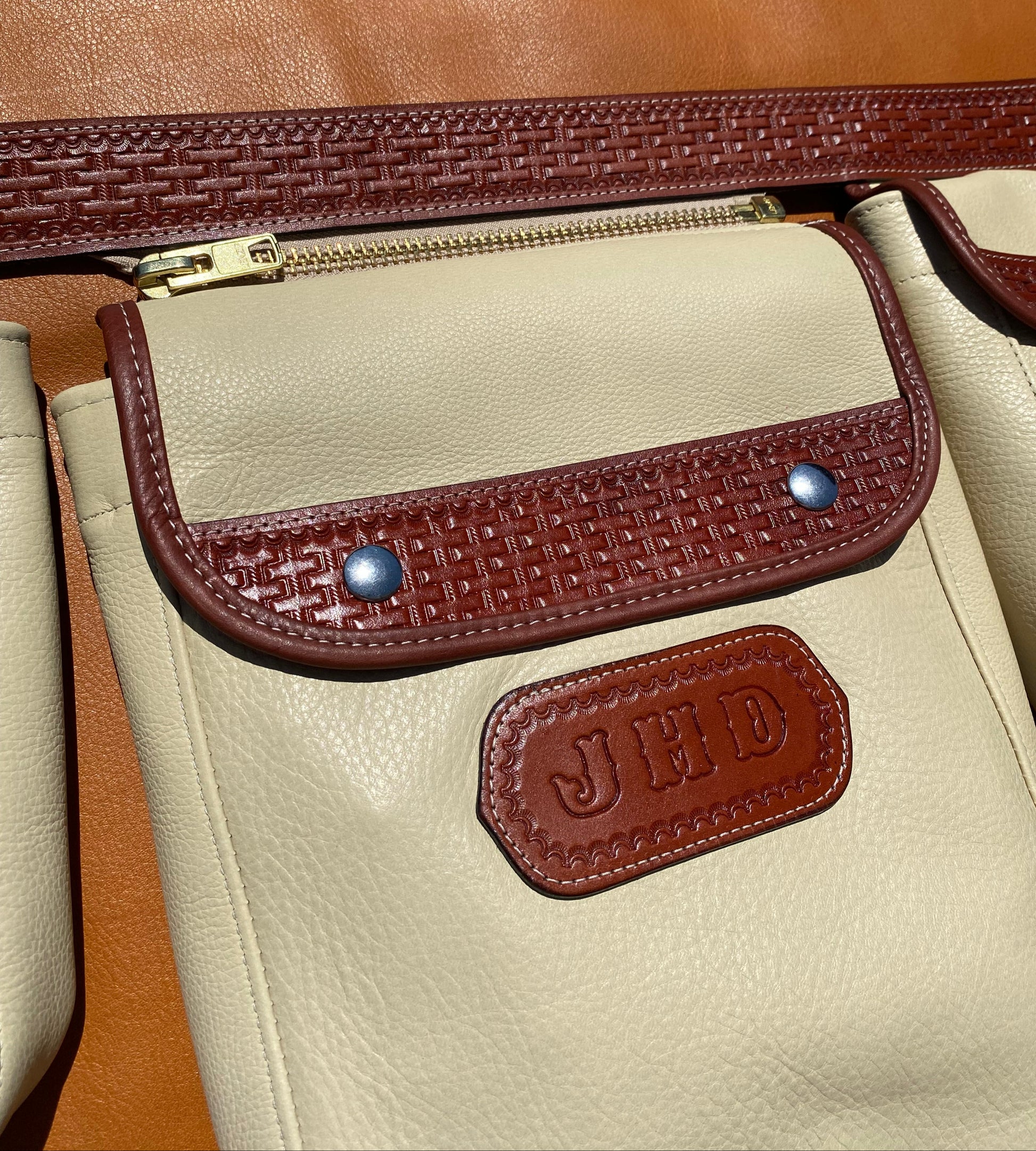 brown leather hunting bag basket stamped pattern and a nickel roller buckle, featuring Soft Deer Tanned Cowhide. dove hunting quail hunting shooting sports clay shooting shotgun 12 gauge 20 gauge skeet